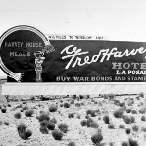 Historic Fred Harvey Hotel La Posada road sign on historic Route 66 circa 1935